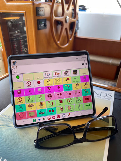 Galaxy Z Fold8 Ultra unfolded on a table as a portable AAC speech tablet with TalkTablet PRO